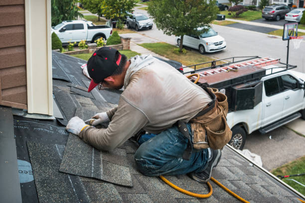 Professional Roof Replacement technician working in Brookston, IN